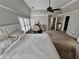 Main bedroom with ceiling fan, large windows, and walk-in closet at 2968 Winterthur Close Nw, Kennesaw, GA 30144