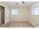 Well-lit bedroom featuring ceiling fan and large closet at 3701 Glen Mora Dr, Decatur, GA 30032