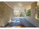 Covered brick patio provides sheltered outdoor space at 3701 Glen Mora Dr, Decatur, GA 30032
