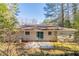 Tan brick house with sliding glass doors and patio at 3701 Glen Mora Dr, Decatur, GA 30032