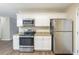 Updated kitchen features granite countertops and stainless steel appliances at 3701 Glen Mora Dr, Decatur, GA 30032