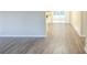 Open living space with wood-look floors and access to the kitchen at 3701 Glen Mora Dr, Decatur, GA 30032