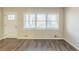 Living room with wood-look floors and neutral walls at 3701 Glen Mora Dr, Decatur, GA 30032