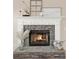 Stone fireplace with white mantel and decorative accents at 6218 Old Stilesboro Nw Rd, Acworth, GA 30101