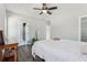 Bedroom with hardwood floors, ceiling fan, and ensuite bathroom at 665 Ferris Sw St, Atlanta, GA 30310