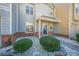 Two-story townhome with blue door and landscaped front yard at 3284 Long Iron Pl, Lawrenceville, GA 30044