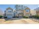 Two-story townhome with attached garage and landscaping at 3284 Long Iron Pl, Lawrenceville, GA 30044