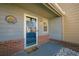 Townhome entrance with blue door and brick accents at 3284 Long Iron Pl, Lawrenceville, GA 30044