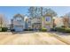 Townhouse with two-car garage and landscaped yard at 3284 Long Iron Pl, Lawrenceville, GA 30044