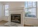 Fireplace with a white and grey tile surround at 3284 Long Iron Pl, Lawrenceville, GA 30044