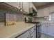 Kitchen with stainless steel appliances and white cabinets at 3284 Long Iron Pl, Lawrenceville, GA 30044