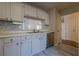 Kitchen with pass-through window and stainless steel appliances at 3284 Long Iron Pl, Lawrenceville, GA 30044