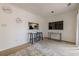 Living area with kitchen pass-through and two bar stools at 3284 Long Iron Pl, Lawrenceville, GA 30044
