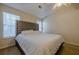 Main bedroom with king-size bed and tufted headboard at 3284 Long Iron Pl, Lawrenceville, GA 30044
