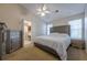 Main bedroom with king bed, ensuite bathroom, and dresser at 3284 Long Iron Pl, Lawrenceville, GA 30044