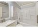 Bathroom with bathtub, shower, and white vanity at 24 Echo Ridge Dr, Powder Springs, GA 30127