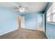 Bedroom with light blue walls and ceiling fan at 24 Echo Ridge Dr, Powder Springs, GA 30127