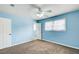 Blue bedroom with ceiling fan and carpet at 24 Echo Ridge Dr, Powder Springs, GA 30127