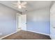 Bedroom with carpet, ceiling fan, and grey walls at 24 Echo Ridge Dr, Powder Springs, GA 30127