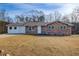 Brick ranch house with attached garage and spacious yard at 24 Echo Ridge Dr, Powder Springs, GA 30127