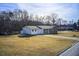 Ranch home with attached garage and a large yard at 24 Echo Ridge Dr, Powder Springs, GA 30127
