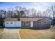 Brick ranch home with attached garage and spacious yard at 24 Echo Ridge Dr, Powder Springs, GA 30127