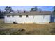 White side of the house with AC unit and yard at 24 Echo Ridge Dr, Powder Springs, GA 30127