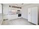Kitchen with white cabinets, vinyl flooring, and appliances at 24 Echo Ridge Dr, Powder Springs, GA 30127