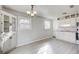 Eat-in kitchen with white cabinets and vinyl flooring at 24 Echo Ridge Dr, Powder Springs, GA 30127