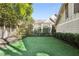 Landscaped backyard with artificial turf and white fence at 566 Church Ne St, Marietta, GA 30060