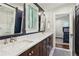 Elegant bathroom with double vanity, quartz countertop, and a large mirror at 566 Church Ne St, Marietta, GA 30060
