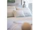 Close-up view of a bed with light blue and white bedding at 566 Church Ne St, Marietta, GA 30060