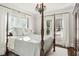 Elegant bedroom with four-poster bed and ample natural light at 566 Church Ne St, Marietta, GA 30060