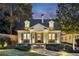 Charming brick home with a welcoming front porch and landscaping at 566 Church Ne St, Marietta, GA 30060