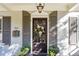 Elegant front door with a wreath and sidelights at 566 Church Ne St, Marietta, GA 30060