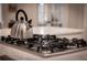 Modern gas cooktop with stainless steel kettle at 566 Church Ne St, Marietta, GA 30060