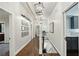 Long hallway with hardwood floors and white walls at 566 Church Ne St, Marietta, GA 30060