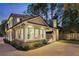 Elegant home exterior at dusk with landscape lighting at 566 Church Ne St, Marietta, GA 30060