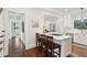 Spacious kitchen with island, white cabinets, and marble countertops at 566 Church Ne St, Marietta, GA 30060