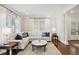 Open living room with hardwood floors and ample natural light at 566 Church Ne St, Marietta, GA 30060