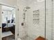 Spa-like shower with marble tile and glass enclosure at 566 Church Ne St, Marietta, GA 30060