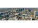 Extensive aerial view of the city's buildings, showcasing a mix of low-rise and high-rise structures and complex streets at 3325 Piedmont Ne Rd # 2702, Atlanta, GA 30305