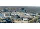 Wide aerial view of the city featuring a mall, highways, and buildings, showcasing urban layout and extensive development at 3325 Piedmont Ne Rd # 2702, Atlanta, GA 30305
