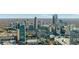 Breathtaking aerial view of the city skyline, highlighting modern buildings, dense urban layout, and surrounding landscape at 3325 Piedmont Ne Rd # 2702, Atlanta, GA 30305