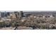 A neighborhood full of high-rise buildings surrounded by trees and highways with skyline in the background at 3325 Piedmont Ne Rd # 2702, Atlanta, GA 30305