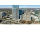Striking aerial view of a modern, glass skyscraper in an urban setting, showcasing sleek design and impressive height at 3325 Piedmont Ne Rd # 2702, Atlanta, GA 30305