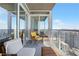 Spacious balcony featuring comfortable seating with a table, offering panoramic views of the city skyline at 3325 Piedmont Ne Rd # 2702, Atlanta, GA 30305