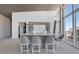 Contemporary bar area with sleek countertops, modern barstools, and cityscape views through large windows at 3325 Piedmont Ne Rd # 2702, Atlanta, GA 30305
