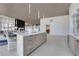 Open-concept bar with sleek countertops, plenty of seating, and views of a cozy sitting area at 3325 Piedmont Ne Rd # 2702, Atlanta, GA 30305