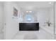 Modern bathroom with a double vanity, soaking tub, and tiled shower, offering a spa-like experience at 3325 Piedmont Ne Rd # 2702, Atlanta, GA 30305